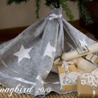 Christmas tree skirt made from a grey moving blanket