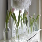pink tulips in front of a mirror as mantel decoration for Spring