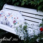white wooden bench in garden