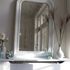 white mantel display with mirror