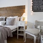bedroom in white and grey with repurposed wood headboard via Songbirdblog