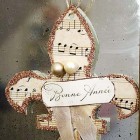 Christmas ornament sheet music and glitter