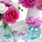 table decoration with pink roses and peonies in aqua vases