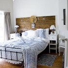 blue and white bedding and a vintage bedspread in a summer bedroom on Songbirdblog