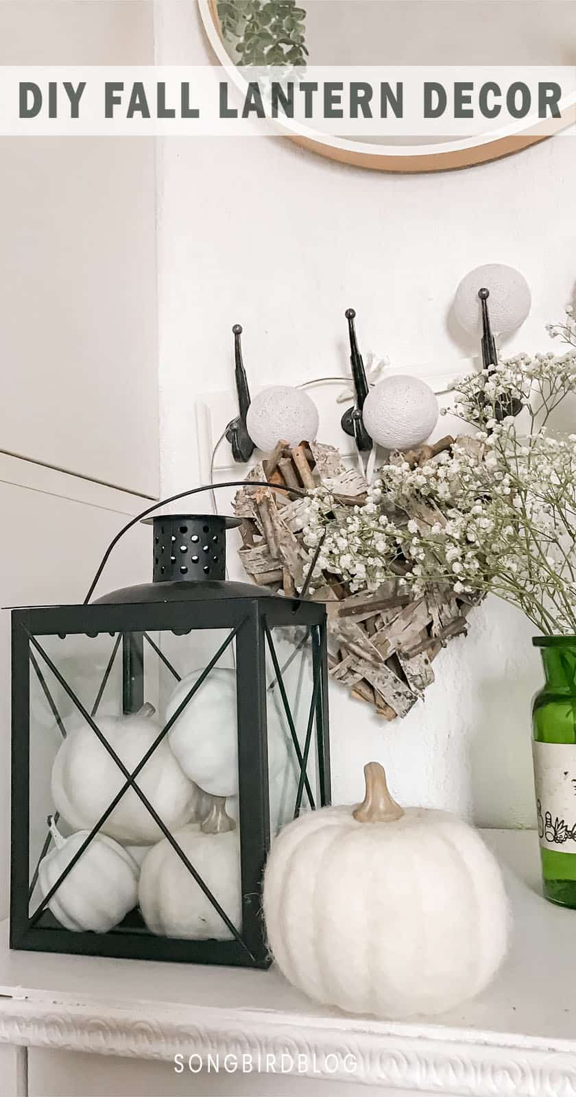fall lantern decor with a black lantern filled with white pumpkins
