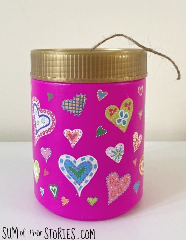 Upcycled pink can with painted hearts decor