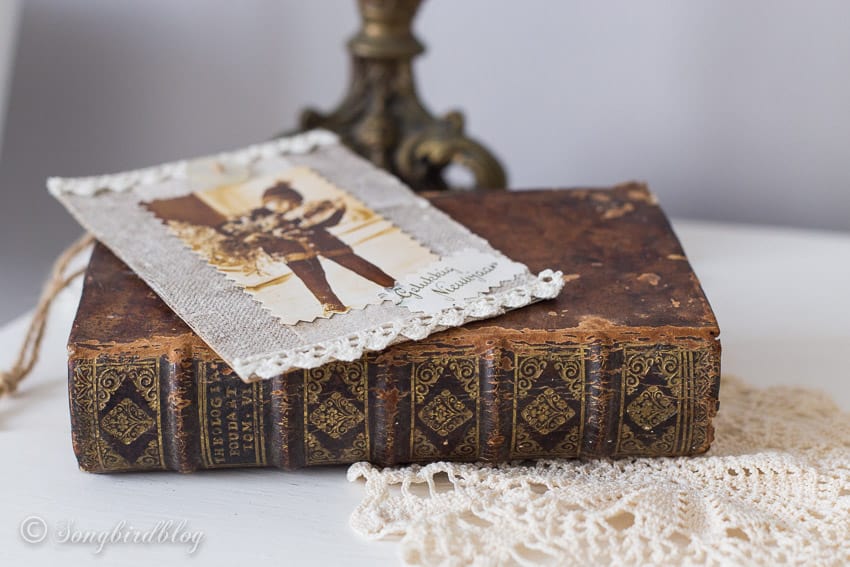 Vintage book with homemade Christmas card