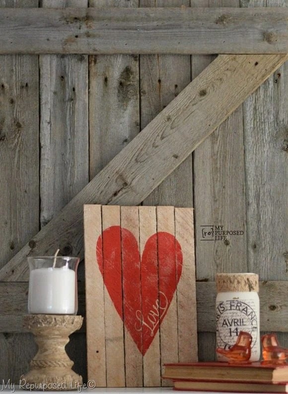 homemade rustic wood sign with red heart decor